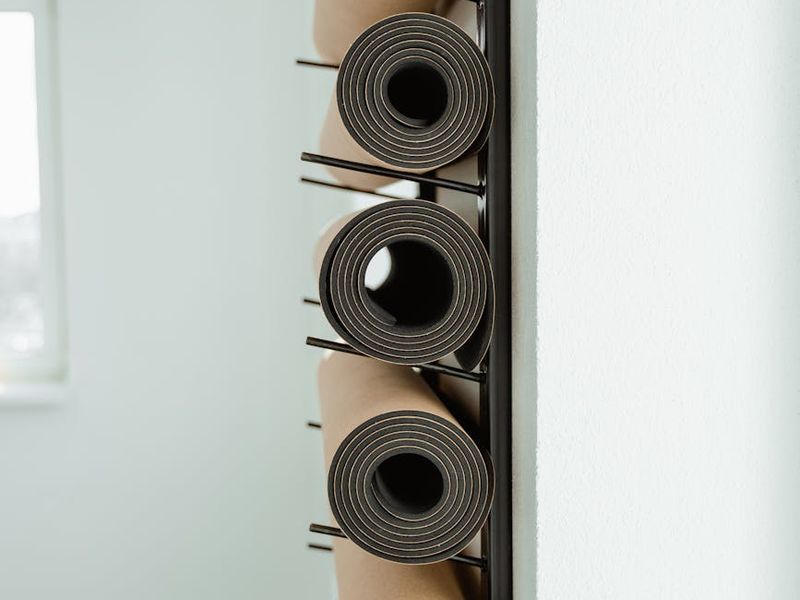 Minimalist yoga studio interior with mats and soft lights